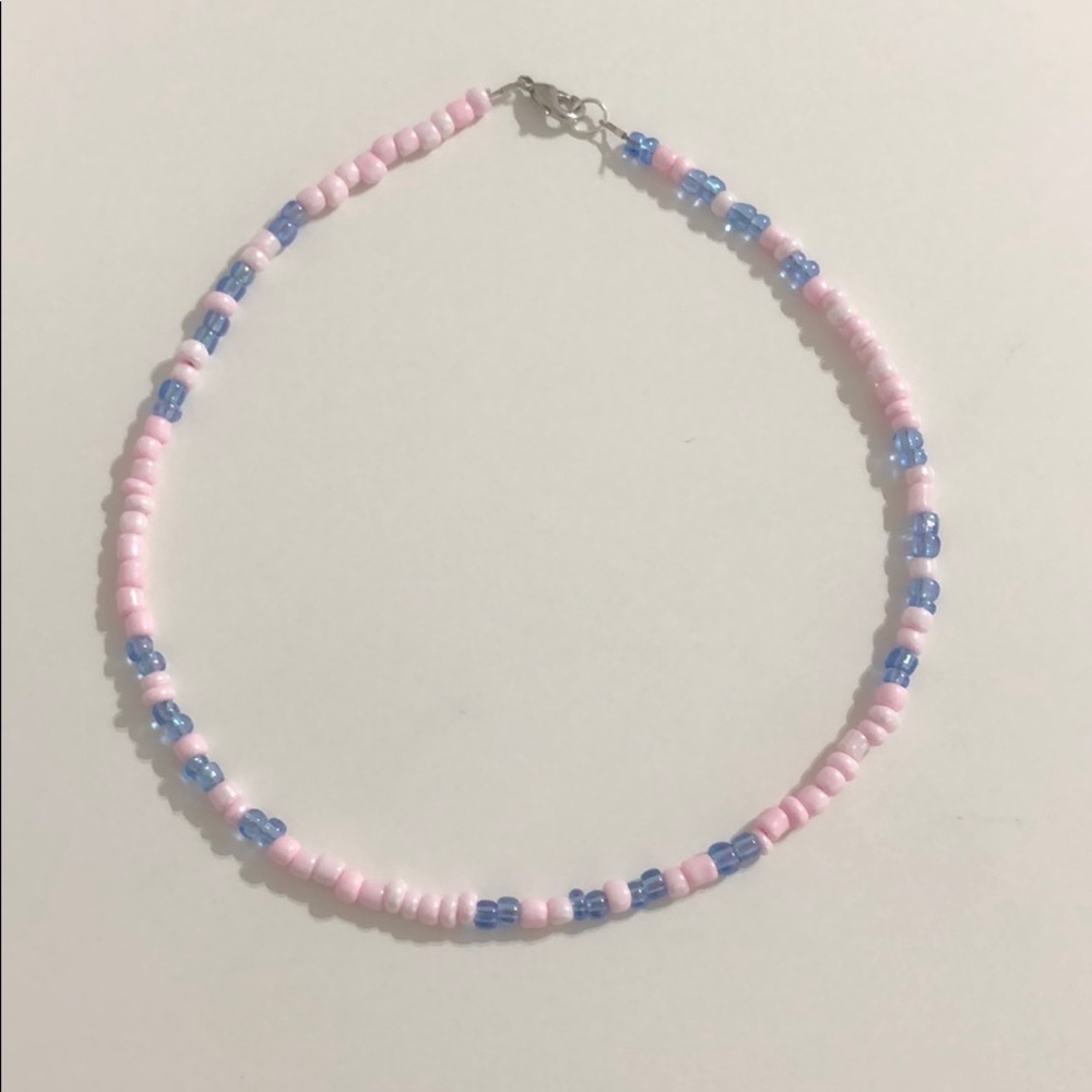 Light pink and iridescent blue patterned necklace